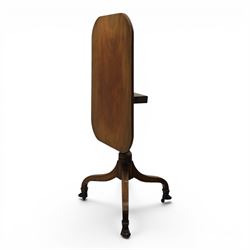 George III mahogany tripod table, rounded rectangular tilt top, raised on a turned column, on splayed supports, terminating brass claw feet above castors