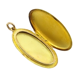  Early 20th century gold oval pendant locket, stamped 15ct   