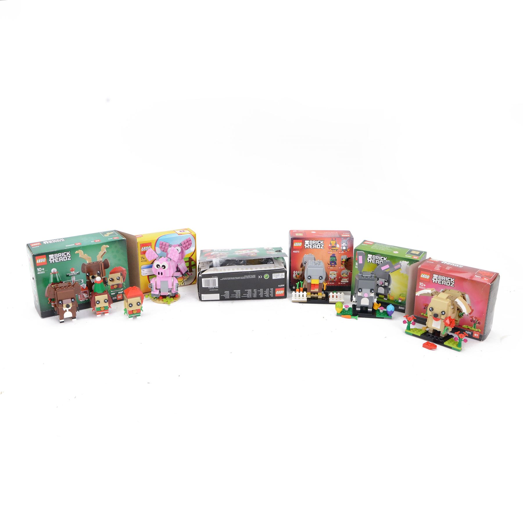 Six Lego Brick Headz built figures, including 40353 Elf, Reindeer and Elfie, 40274 Mr Claus and Mrs Claus, 40349 Puppy, 40186 Year of the Pig, 40273 Turkey and 40271 Bunny, all boxed 