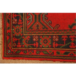  Turkish red ground rug, stylised decoration, 295cm x 148cm  