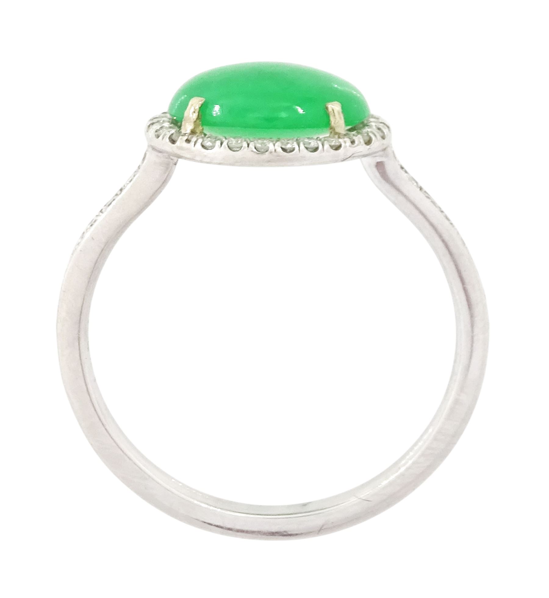 Platinum jadeite and diamond cluster ring, single oval cabochon cut jadeite of 2.20 carat, surrounded by round brilliant cut diamonds and diamond set shoulders, stamped Plat