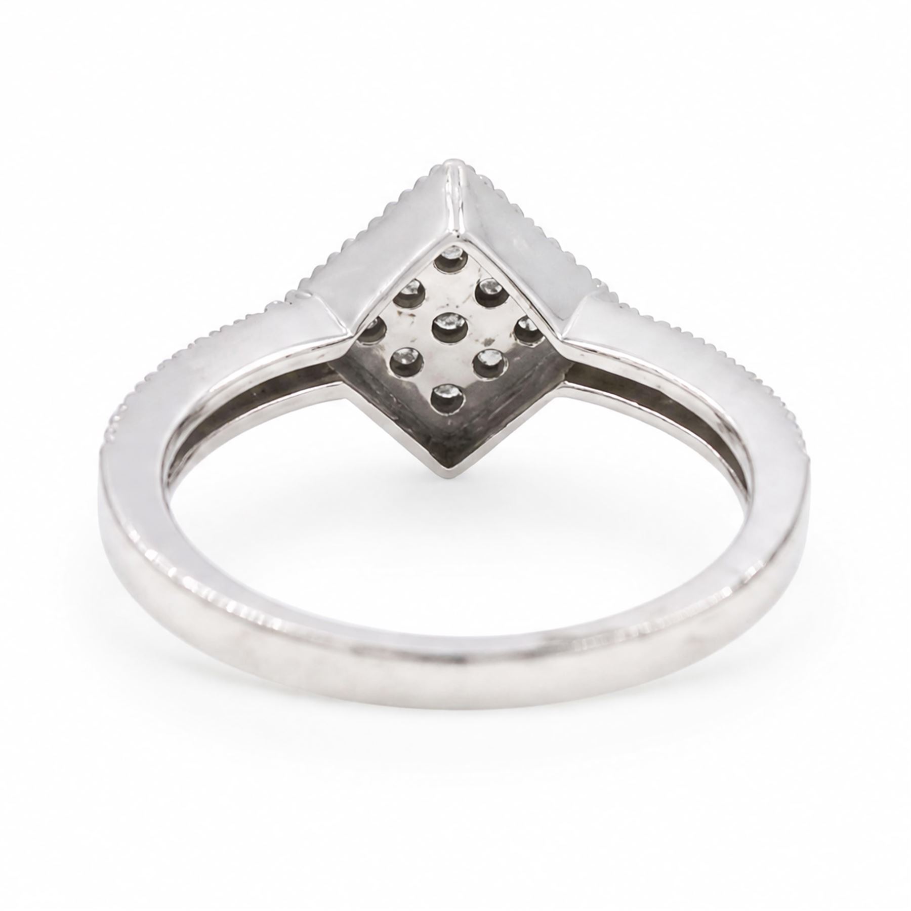 9ct white gold diamond shaped diamond ring, pave set with nine round cut diamonds, with diamond set shoulders, Birmingham 2006