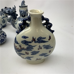  A small Chinese blue and white moon flask, with twin handles, the body decorated with a dragon chasing a flaming pearl amidst auspicious clouds, with Artemisia style leaf mark beneath, H17cm, together with a group of other assorted blue and white Oriental pottery.    