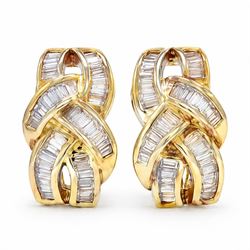 Pair of 18ct gold baguette cut diamond earrings, each stud channel set with baguette cut d...