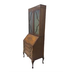 Early 20th century walnut bureau bookcase, two glazed doors over fall front, fitted with three drawers, on shell carved cabriole feet