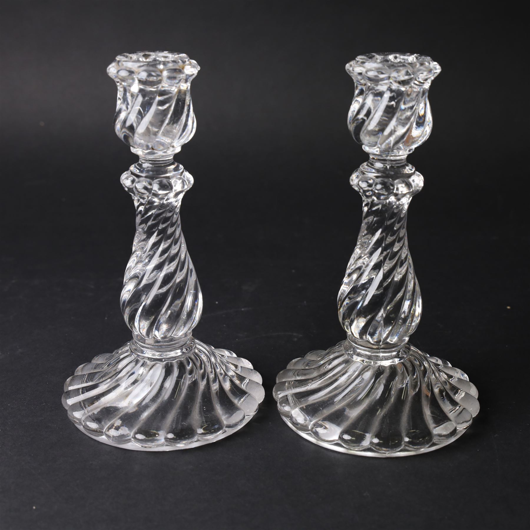 Pair of Baccarat Bambous glass candlesticks, with wrythen moulding, marked beneath, H19cm