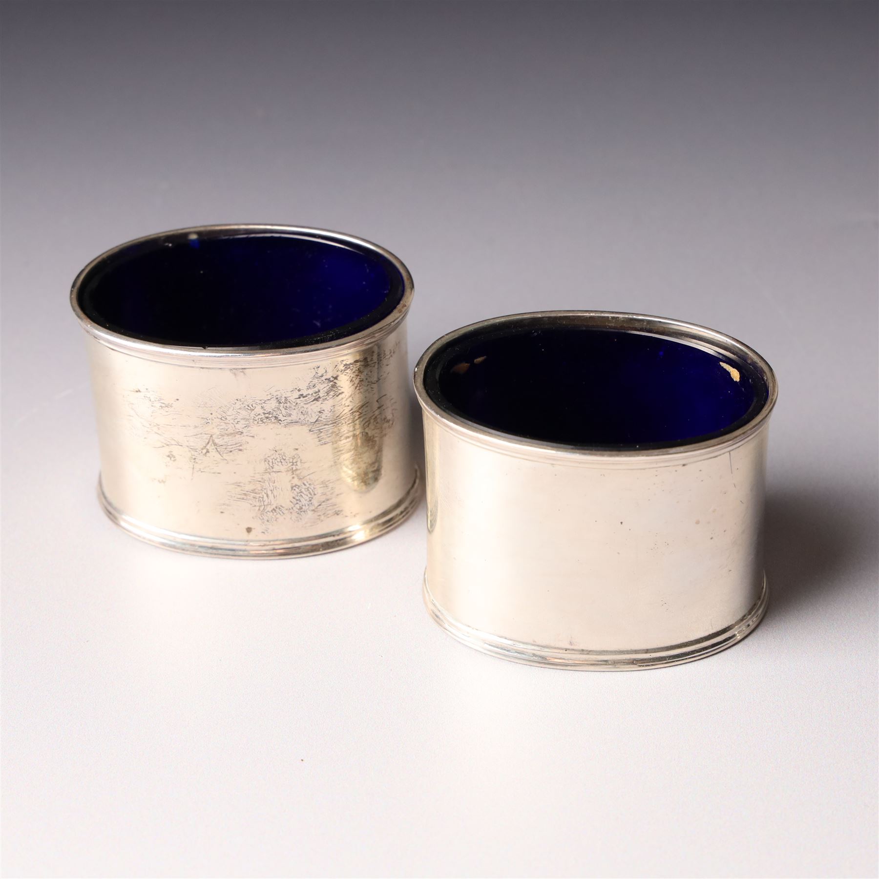 Victorian silver baluster mustard pot with engraved decoration London 1844, pair of silver oval salts and matching mustard  Birmingham 1918 and a circular mustard pot