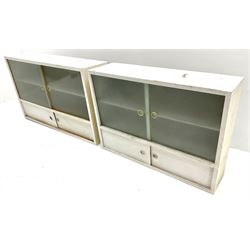 Two mid century wall hanging cabinets, two sliding frosted glazed doors above two sliding doors