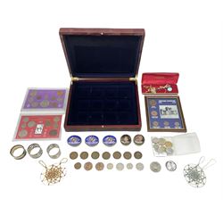 Quantity of coins, to include five pound coin and cased sets, mahogany box with dark blue velvet compartmented interior, hat pin, silver plated napkin rings, etc