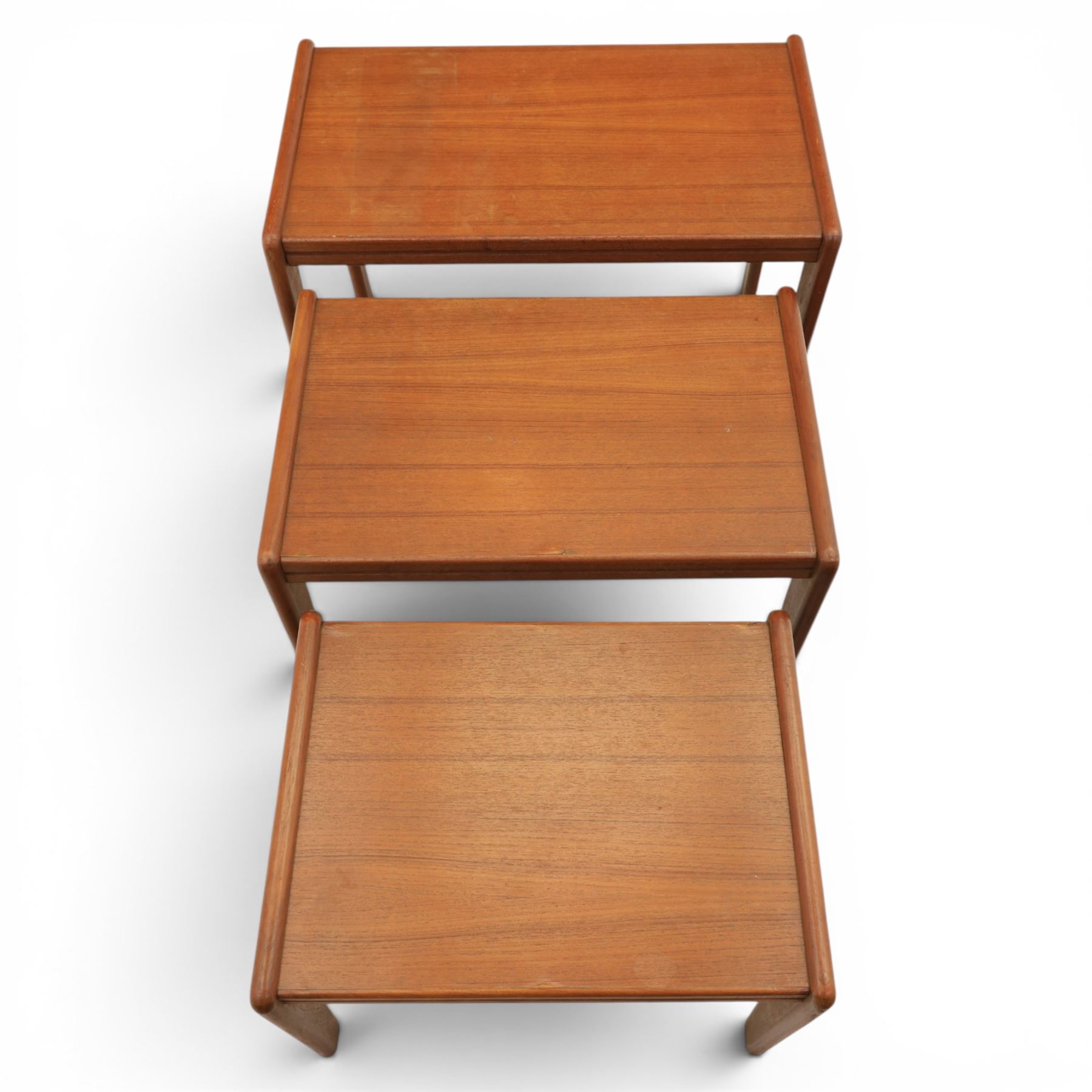 A pair of Nathan 'Highback Carvers' and a 20th century nest of teak tables, (Tables W65cm, D38cm, H49cm)
(Carvers W57, H97)