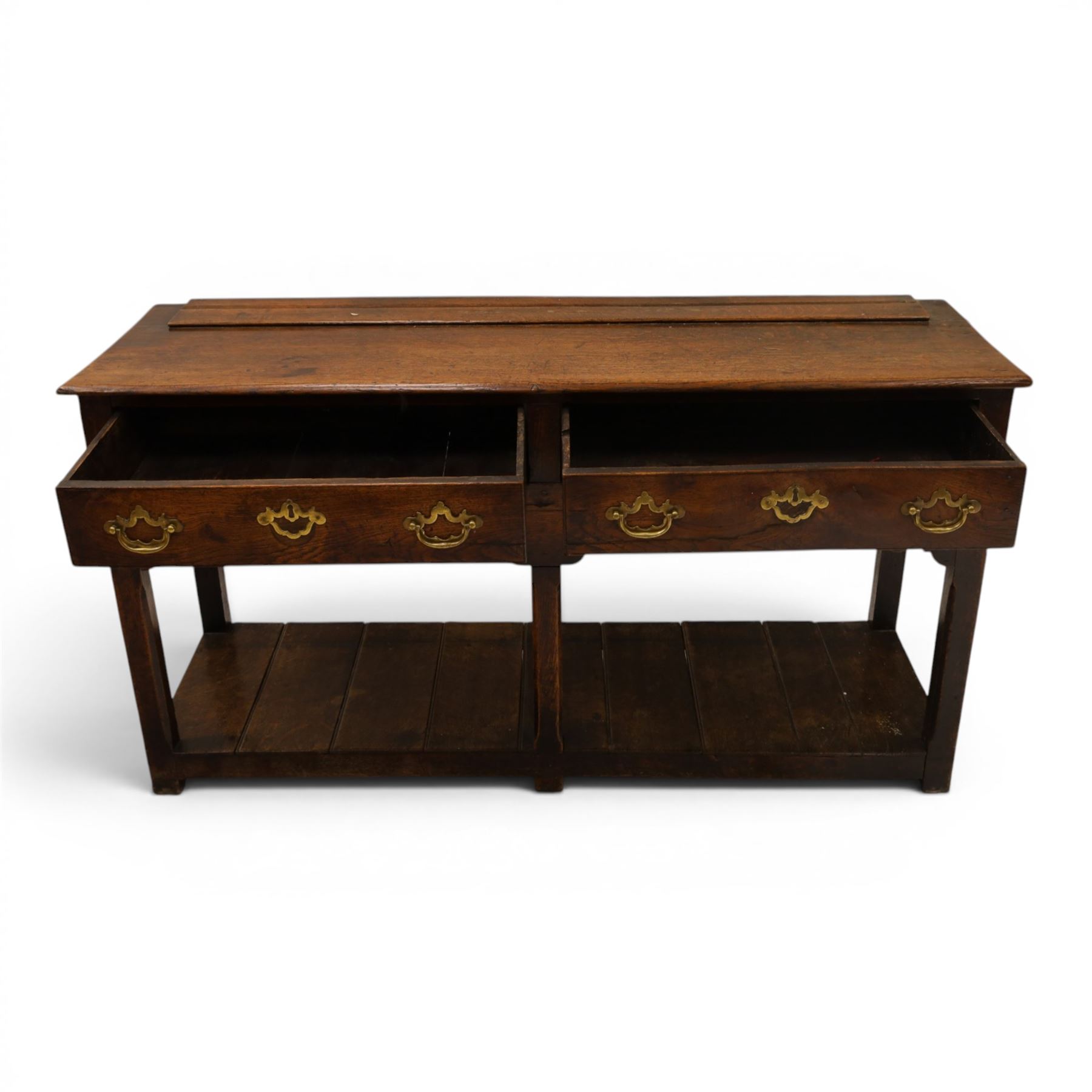George III oak dresser base, rectangular top with moulded edge, fitted with two drawers over shaped spandrels, raised on square chamfered supports united by undertier, on stile feet