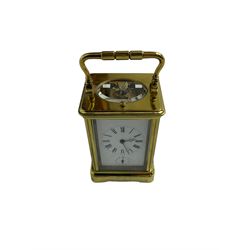 Late 19th century French carriage clock with a lever platform escapement, striking and alarm train and repeat button, in a gilt brass corniche case with an enamel dial, Roman numerals, minute track, steel moon hands and subsidiary alarm dial, eight-day movement striking the hours/half hours and alarm on two coiled gongs, movement backplate stamped G.L, trademark for Gay & Lamaille & Co, French clockmakers and wholesalers, c1880. 