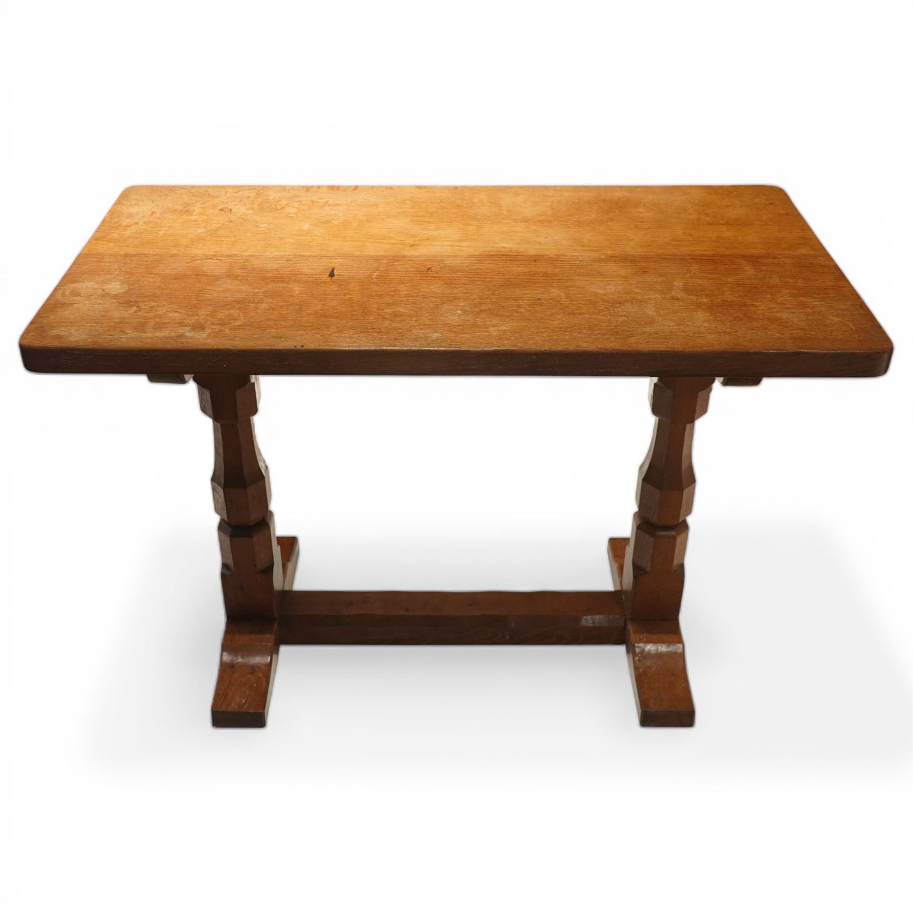 Mouseman - oak side table, rectangular adzed top, raised on octagonal supports united by stretcher on sled feet, with carved mouse signature, by the workshop of Robert Thompson of Kilburn