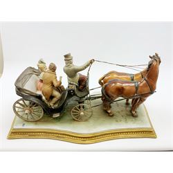 A large Capodimonte figure group, modelled as figurines in a horse drawn open carriage, signed Merli, L62cm, with accompanying certificate. 