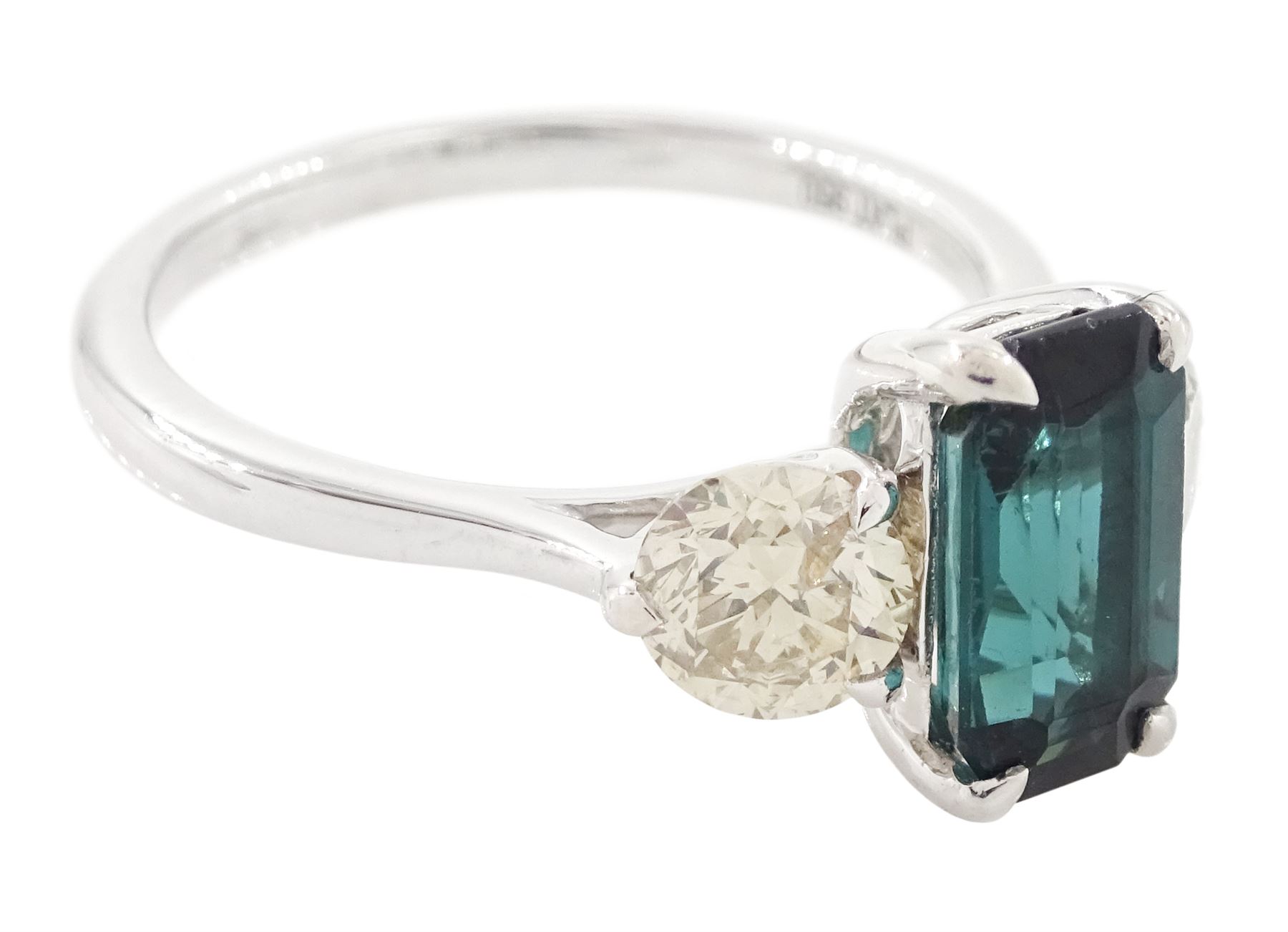 Platinum green tourmaline and diamond three stone ring, single octagonal cut tourmaline of 1.54 carat, with a single round brilliant cut diamond set either side, stamped Plat 950, total diamond weight 1.06 carat