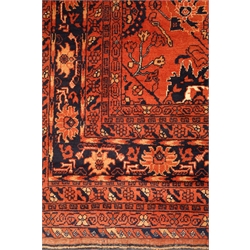  Persian Bokhara red ground rug, repeating floral border, 293cm x 200cm  