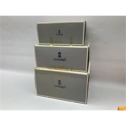 Three Lladro figures, comprising Boy from Madrid no 4898, Nature Bounty no 1417 and Purrfect Friends no 6512, all with original boxes, largest example H24cm