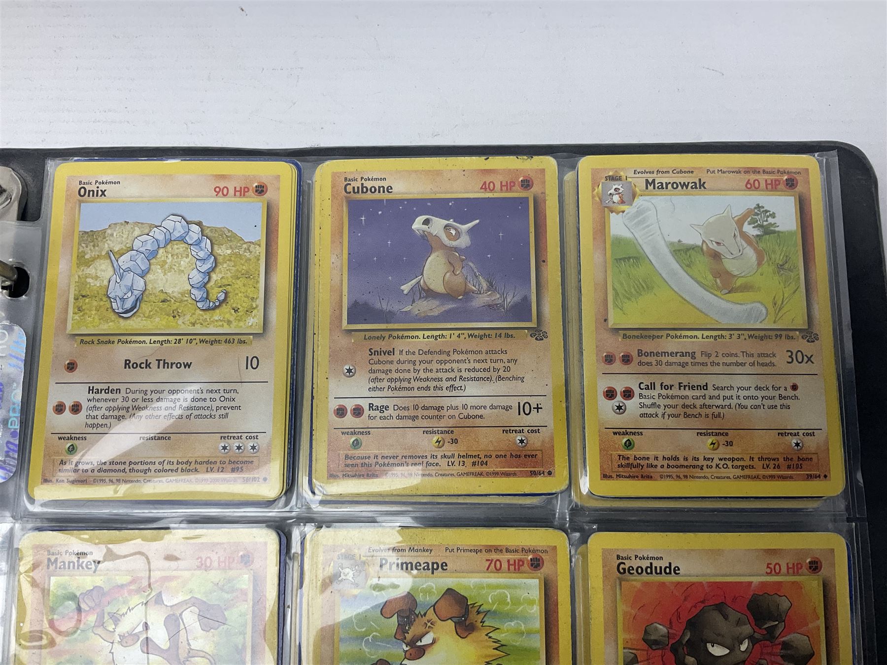 Collection of Pokemon trading cards, mostly 1999 Wizards Pokemon cards to include holo Charizard 4/102, first edition holo Machamp 8/102, further holographic cards; Dark Flareon 35/82 and Dark Vaporeon 45/82, cards from themed sets and 4th edition prints; 1998 Electronic Pokédex with cardboard boxes for themed decks Blackout, Overgrowth and Power Reserve Jungle, along with a large quantity of energy and trainer cards 