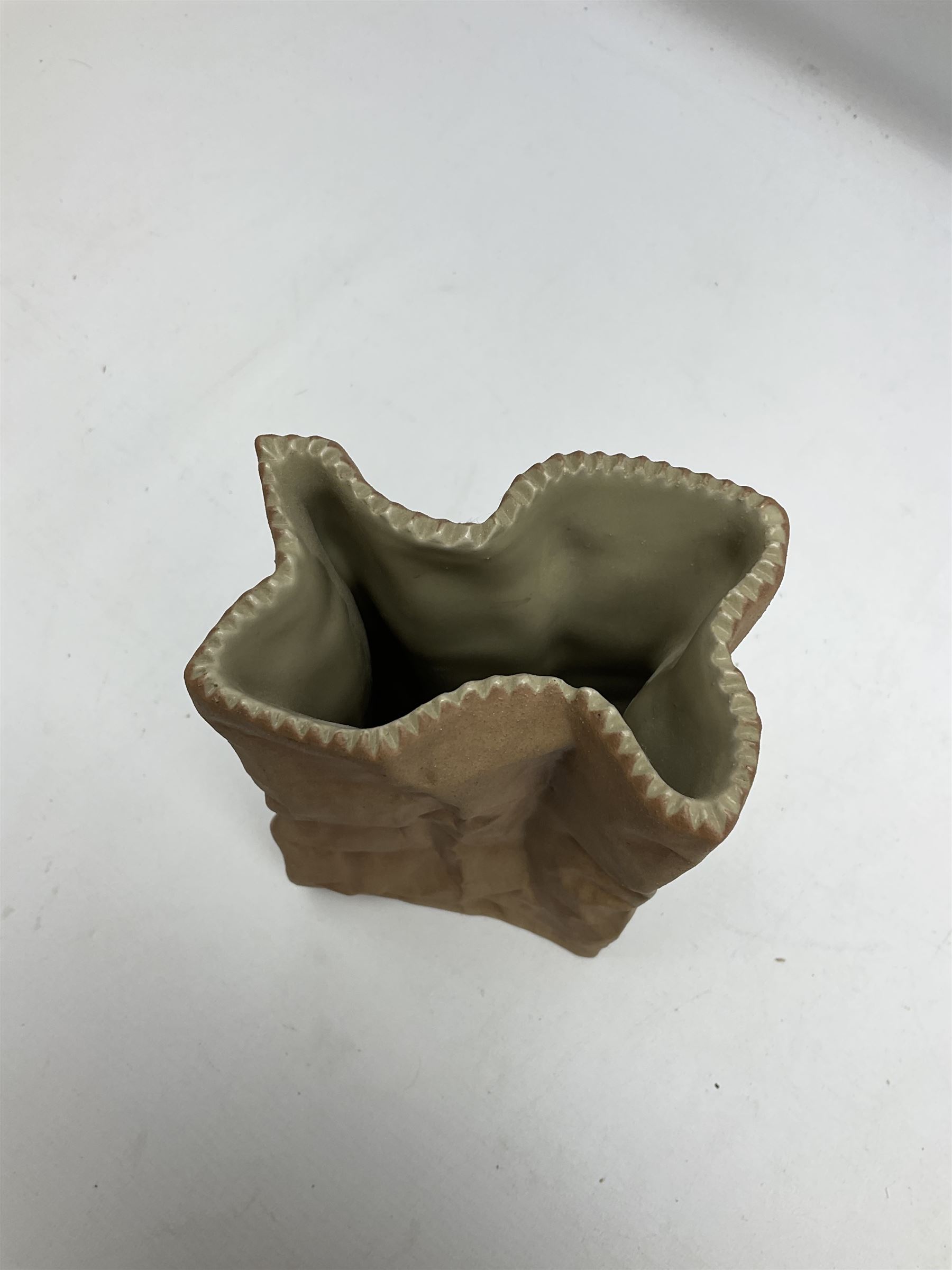 Rosenthal bisque pottery vase in the form of a paper bag, with Rosenthal Studio-linie Germany mark beneath, H22cm