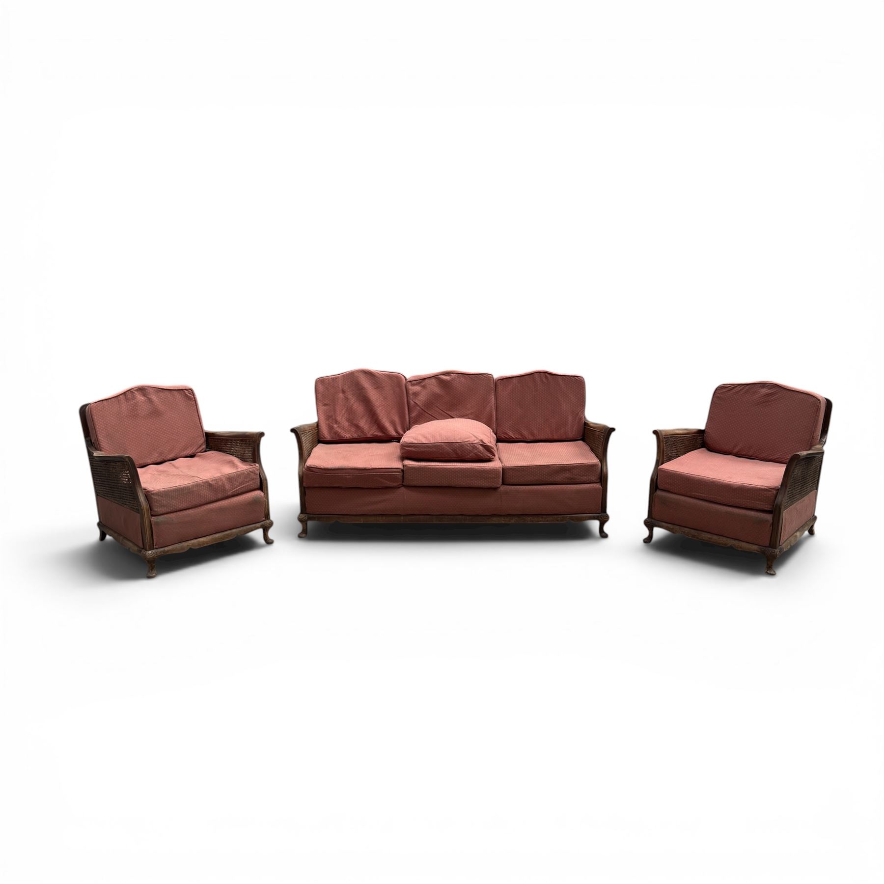 Early 20th century French style bergère conservatory suite, canework back and sides with red upholstered loose seat cushions, on cabriole feet
