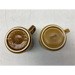 Collection of 1970s Hornsea mugs designed by John Clappison, comprising six Train Robber pattern examples together with owl patterned example on dark teal ground, and further example decorated with stylised hen and chick and egg, approx 9cm, together with four small cup bowls, all with stamped Hornsea marks beneath