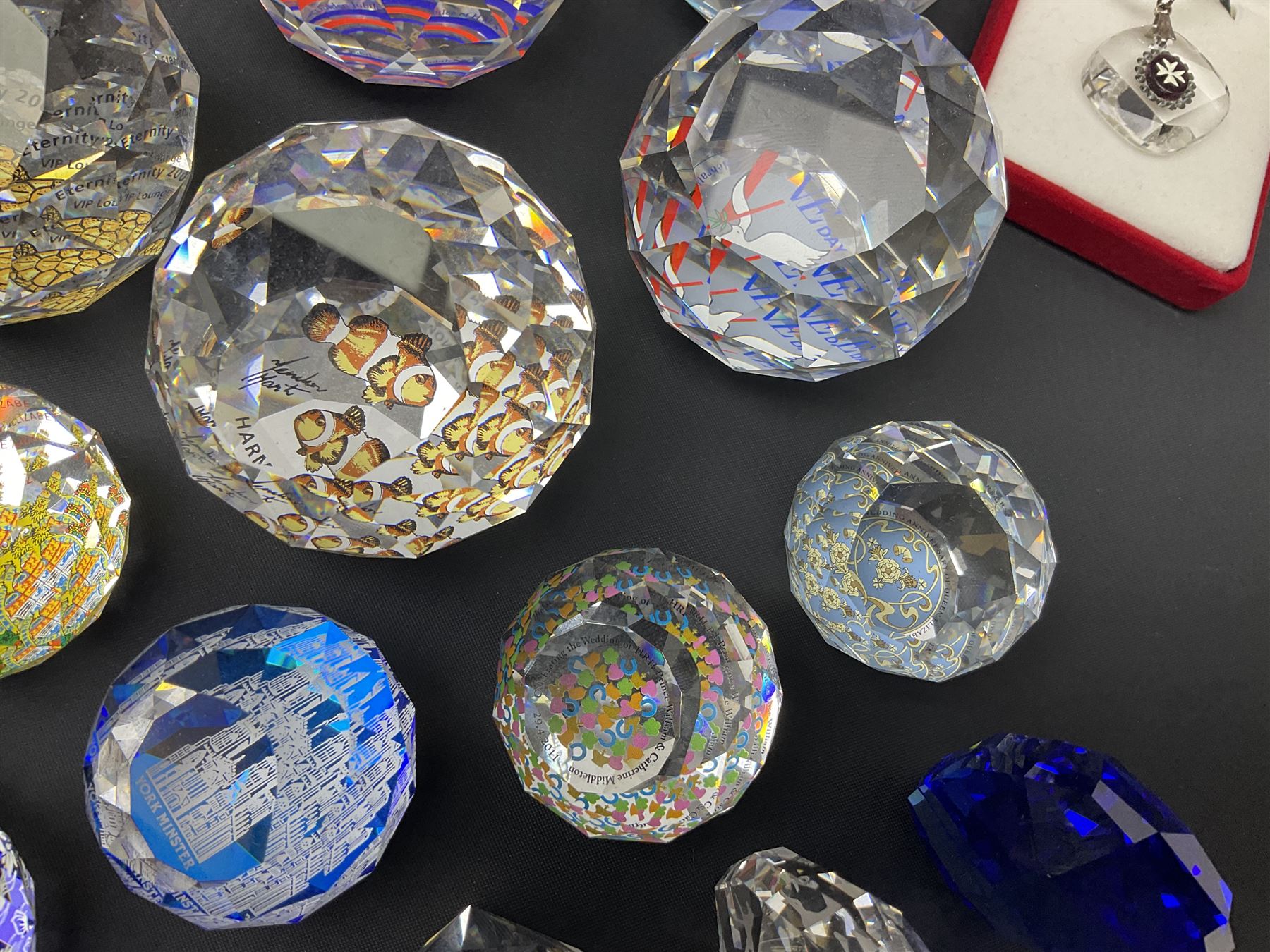 Swarovski Crystal paperweights, to include a globe with dove to the top, pyramid shapes etc, together with a large collection of boxes and stands  