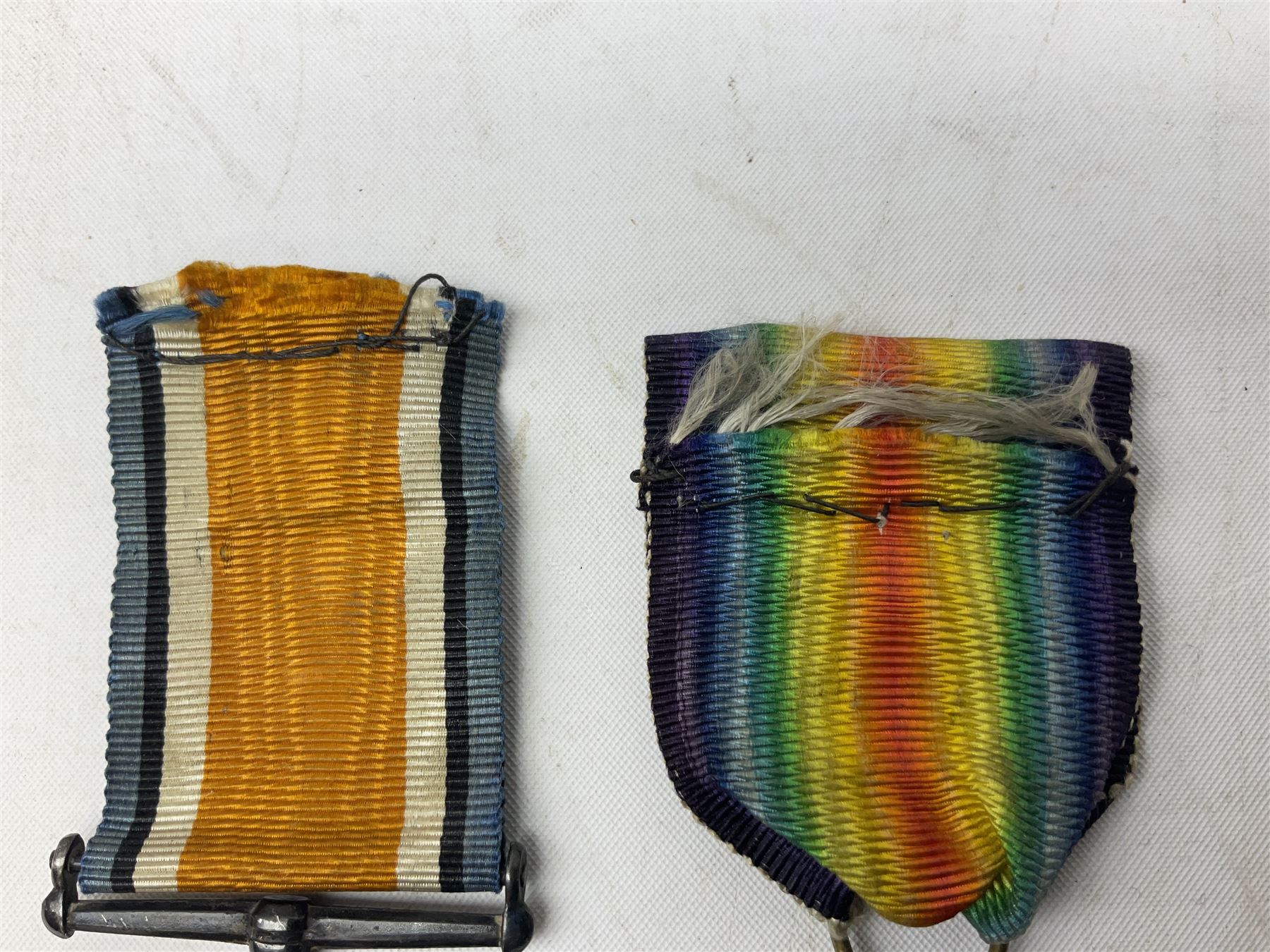 Three WW1 medals comprising 1914-15 Star awarded to 58648 Spr. C. Roberts R.E.; British War Medal and Victory Medal awarded to 87502 1.A.M. C. Roberts R.F.C.; and REME cap badge (4)