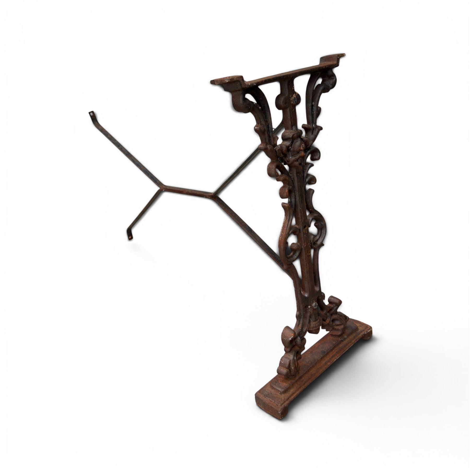 Pair of Victorian cast iron table end supports, of pierced and scrolling foliate design with central masks, united by X-form stretcher, with later top