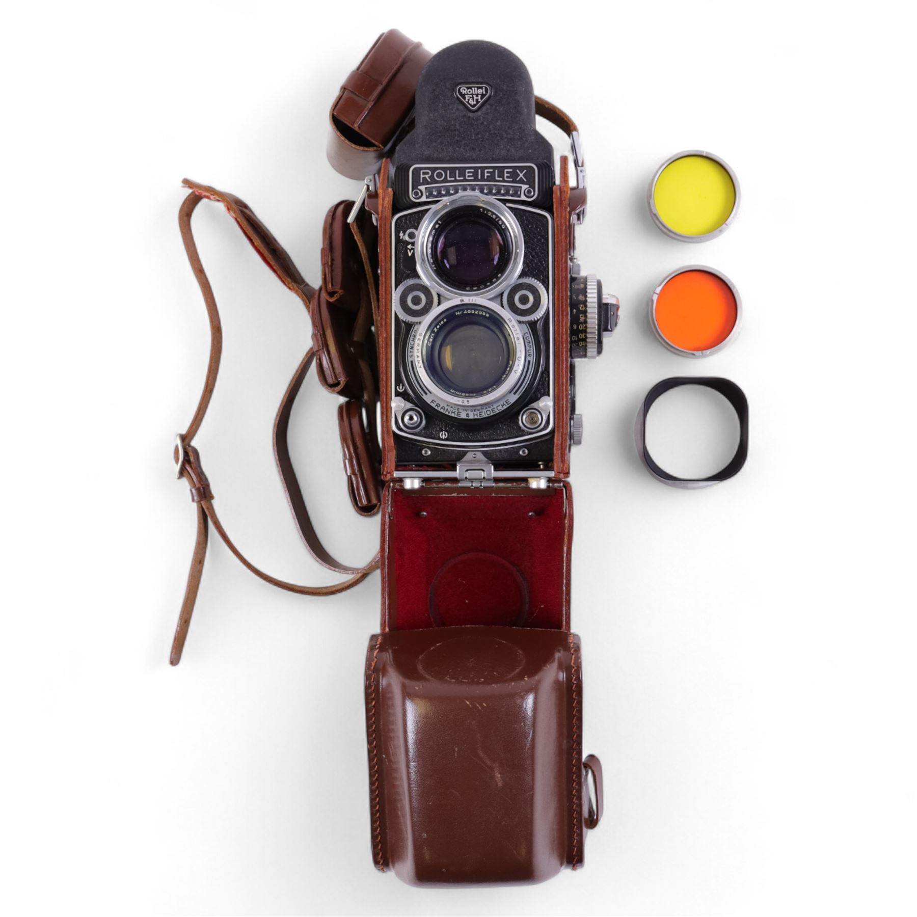 Rolleiflex Franke & Heidecke DBP DBGM 2.8 F TLR camera serial no. 2439093, with a Heidosmat 1:2.8/80 lens serial no. 894062 and a Carl Zeiss Planer 1:2.8 f=80mm lens serial no. 4092068, in leather case with instruction booklet