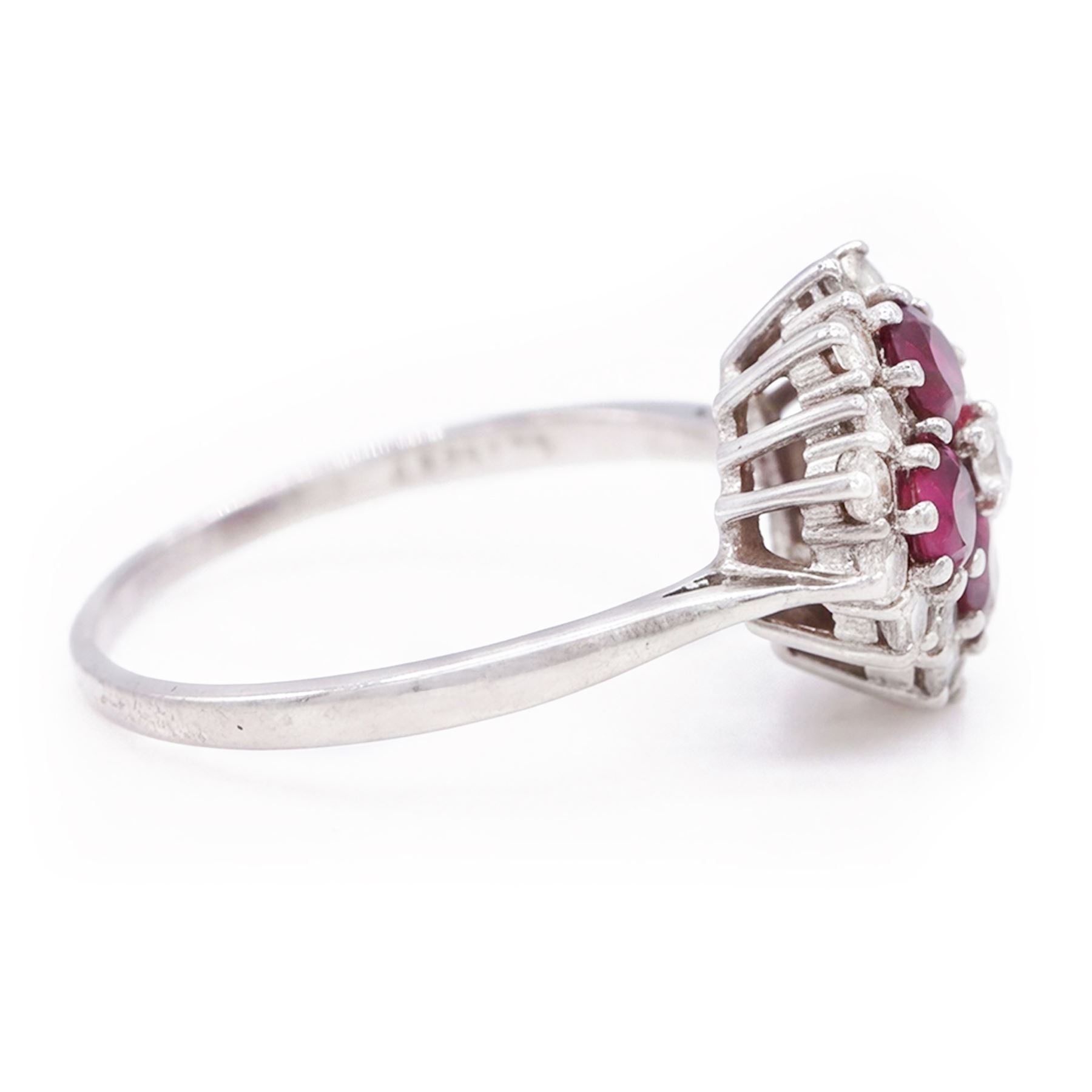 18ct white gold ruby and diamond cluster ring, set with round round cut rubies and seventeen round brilliant cut diamonds, total ruby weight approx 1.15 carat, total diamond weight approx 0.55 carat