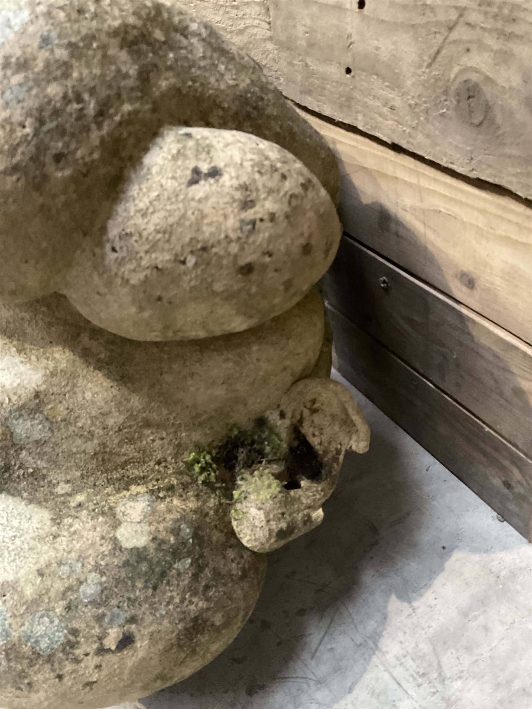 Four grotesque garden wall masks