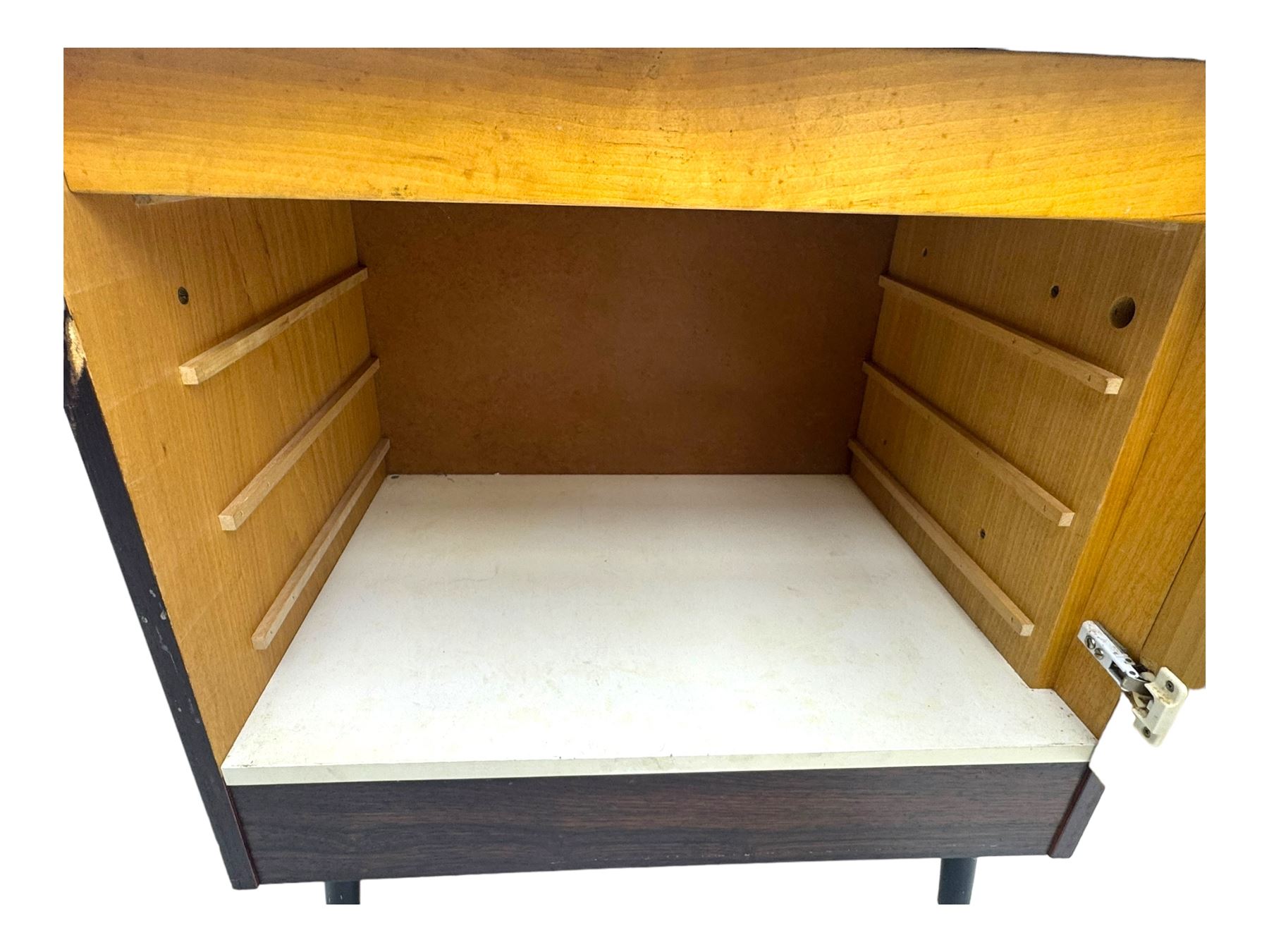 Troeds of Sweden - mid-20th century rosewood veneered cupboard, single door with brass handle enclosing interior fitted with one drawer, raised on ebonised tapered and splayed supports