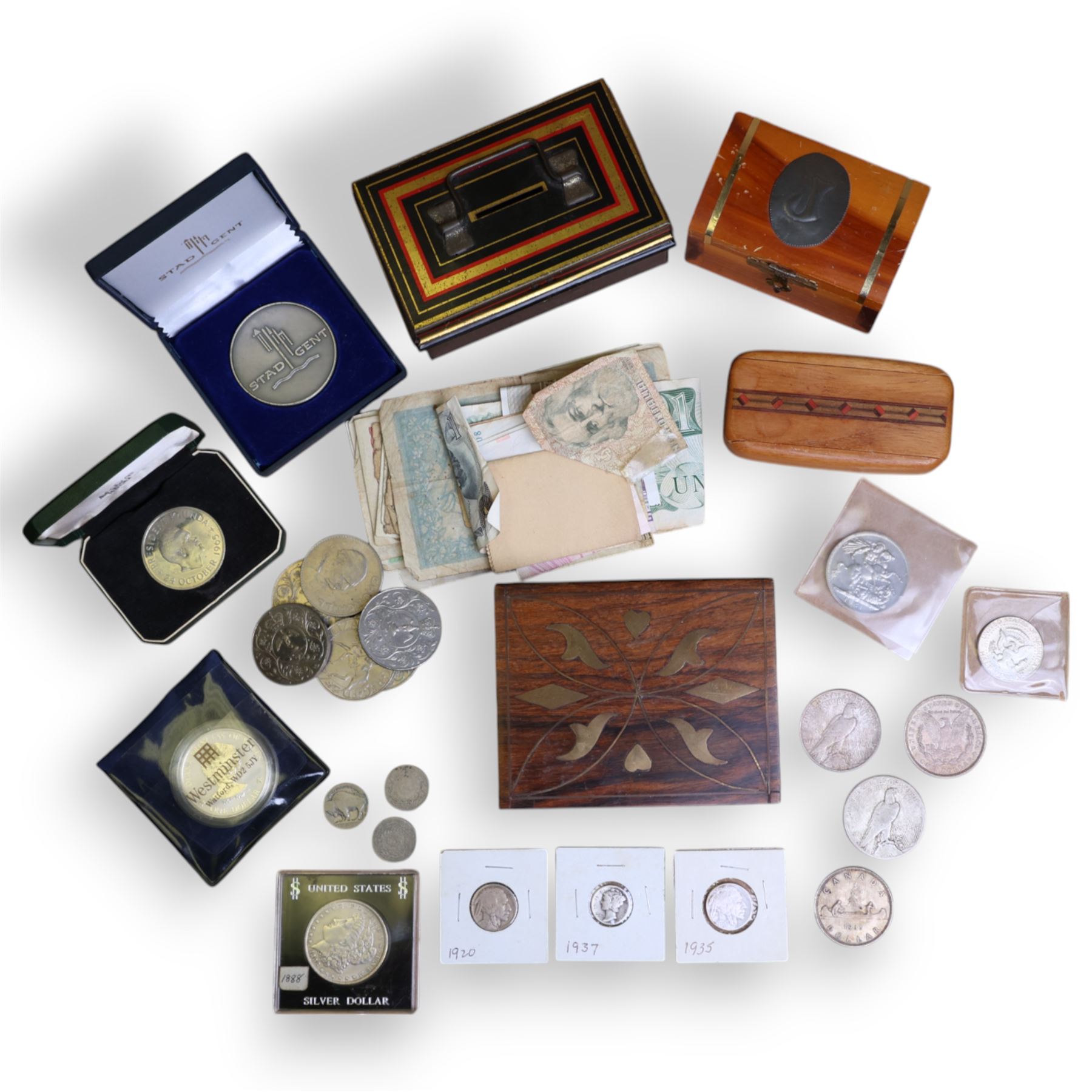 World coins, including four United States of America silver dollars, 1888, 1921, 1922, and 1923, Queen Elizabeth II Cook Islands 1997 fine silver one dollar, King George V Canada 1935 silver dollar, commemorative crowns, etc