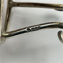 Modern silver limited edition Easter egg, no. 70/500, the gilt openwork body decorated with daffodils and detachable cover with pierced circular panel set with a single faceted blue stone, opening to reveal a gilt interior, upon silver stand with three scrolling pad feet, each hallmarked St James House Company, London 1980, height including stand 8cm