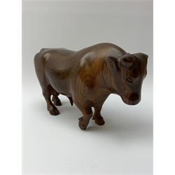 Ann Baxter (British b. 1969): a carved wooden model of a Bull, signed beneath A.W. Baxter, L22cm x H14cm 
