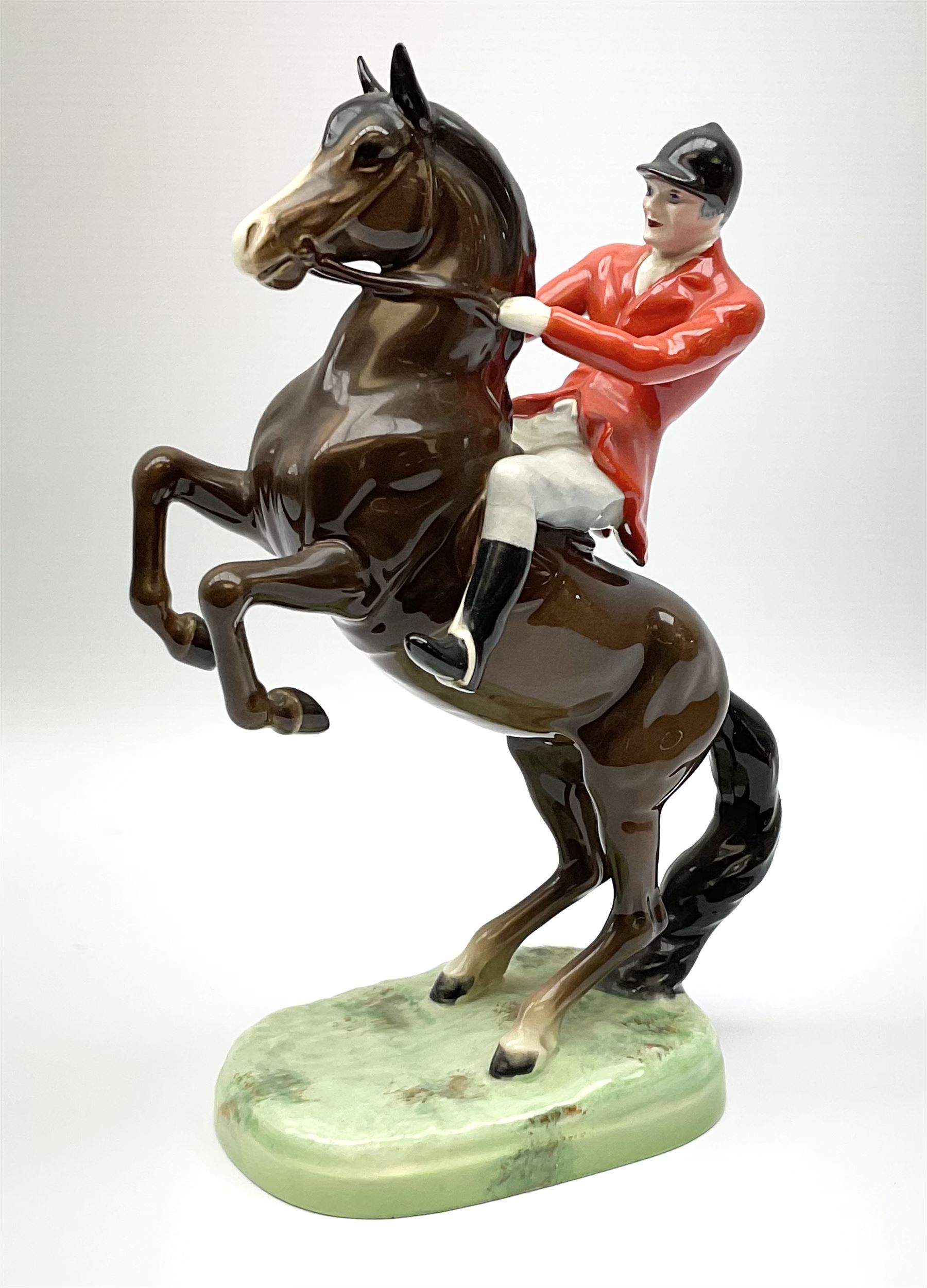 A Beswick model of a huntsman on rearing horse, model no 868 2nd edition, with printed mark