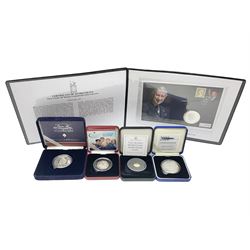 Queen Elizabeth II 2000 'The Queen Mother' silver proof five pound coin, 2000 'Millennium' silver proof five pounds, 2007 'Scouts' silver proof fifty pence, Tristan Da Cunha 2014 9ct gold 1 gram gold one crown coin, all cased with certificates and a 'Prince Charles 60th Birthday Commemorative Coin Cover' containing a 2008 silver proof five pound coin in folder (5)
