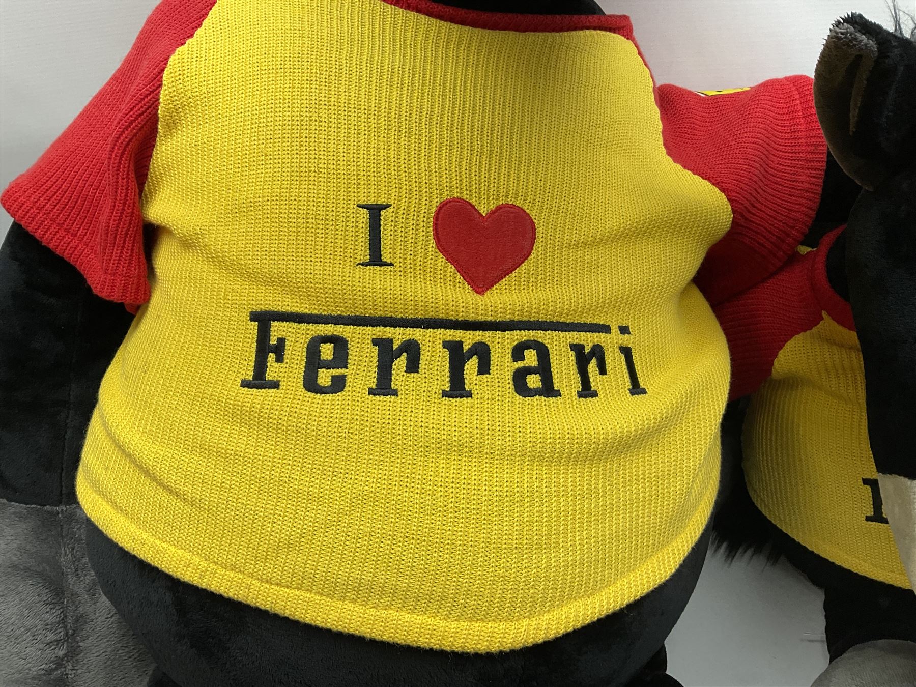Four large Nici plush toys, comprising of two 'I love Ferrari' horses, with baseball hats, zebra and a black sheep, largest example H115cm 