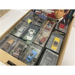 Fabbri James Bond Collection - over one hundred and ten die-cast models in perspex display cases as issued periodically; and a quantity of associated magazines and trading cards, in five boxes