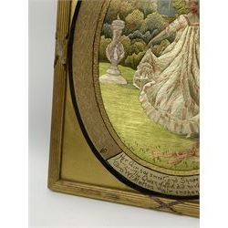 George III silkwork picture, of oval form depicting a female figure in garden setting, within a silkwork border detailed with verse from Robert Burns Bonnie Peg, 'Her air sae sweet, and shape complete, The Queen of Love did never move, Wi' Motion mair enchanting!', and monograms 'FV' and 'SM', in reeded gilt frame and gilt mount, indistinctly inscribed in pencil verso, overall H36cm L30.5cm