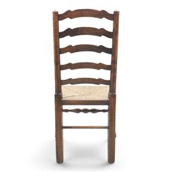 19th century set of six ash and elm ladderback dining chairs, shaped ladder backs above rush seats, raised on turned front supports with pad feet, united by turned stretchers