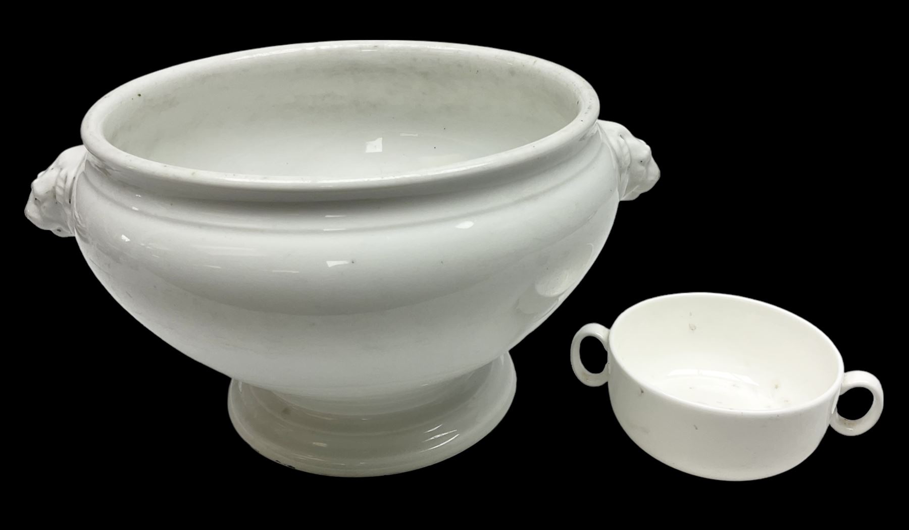 Thun WW2 German Luftwaffe officer's mess plain white glazed soup tureen with lion mask handles, marked with the Luftwaffe eagle beneath and dated 1939 L31cm; together with Waffen 'SS' white glazed twin handled soup bowl, marked beneath Bauscher Weiden 1942 (2)