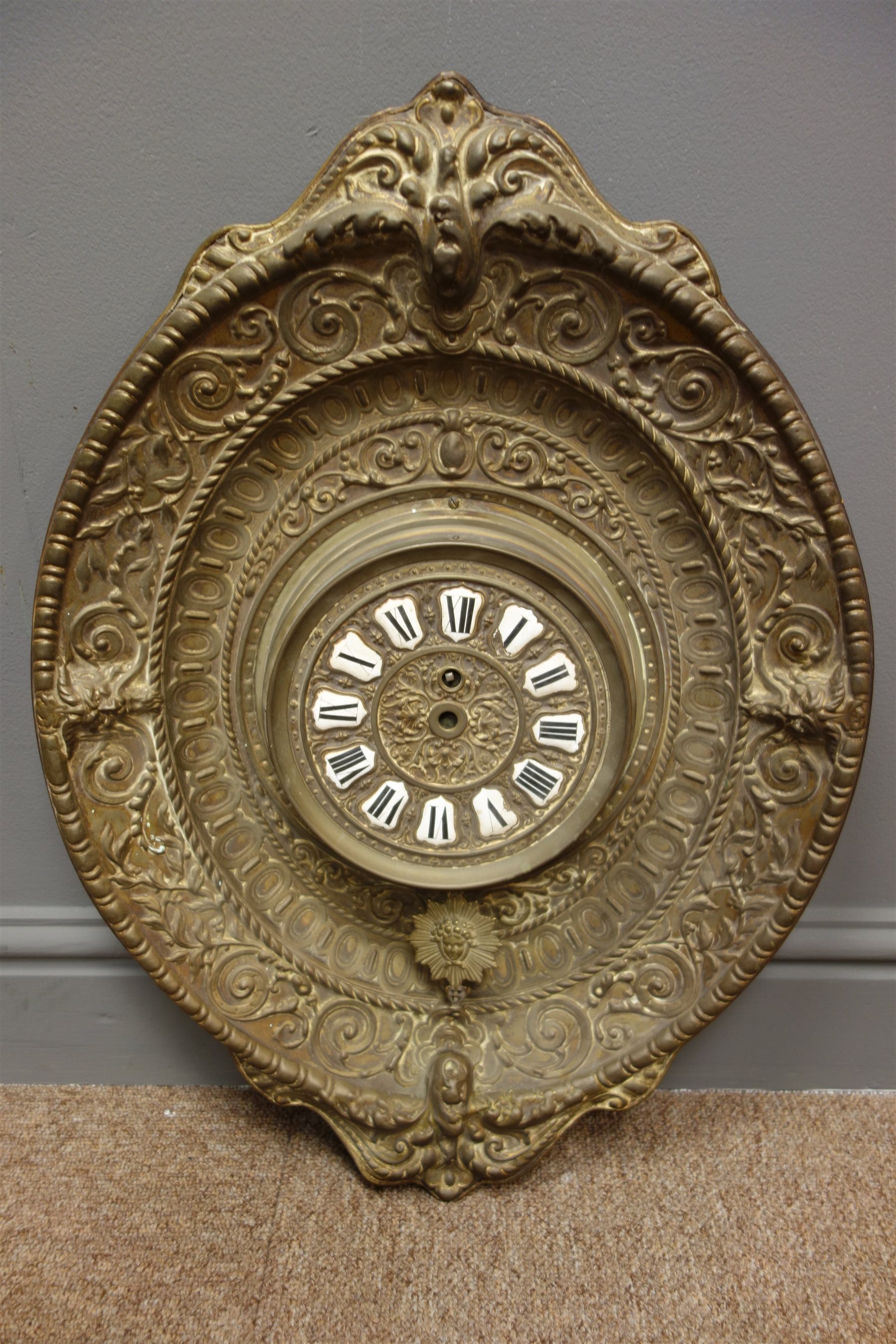 20th century French brass wall clock, white enamel numerals in embossed