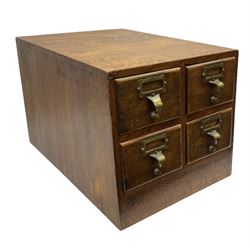 Early/mid 20th century oak four drawer library card index cabinet, of tapering form with brass index card holders and pull handles, H29cm D45cm W33cm
