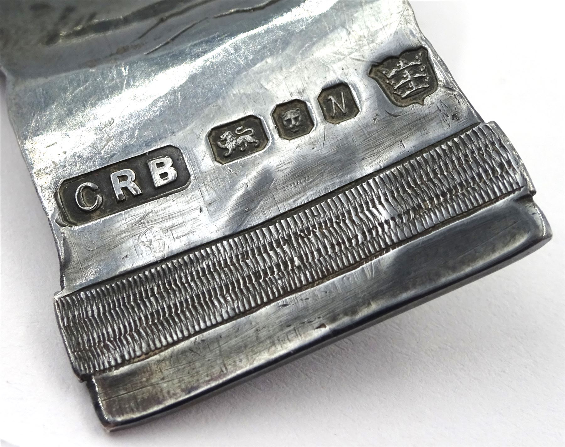 Modern Guild of Hull Silversmiths oxidised silver caddy spoon, modelled as an outstretched hand with engraved wristwatch to wrist and inset turquoise cabochon to finger, hallmarked Charles Richard Berkin of Beverley, London 1987, also marked with the three crowns mark of the Guild of Hull Silversmiths, L 8.7cm, approximate weight 0.89 ozt (27.9 grams)

Abraham Barachin was the last Hull silversmith to use the Hull mark of three ducal coronets in around 1706. 
However in 1983 the Assay Offices of Great Britain and the City of Kingston upon Hull granted the Guild of Hull Silversmiths permission to use the City's Coat of Arms as an additional mark on pieces they produced. 