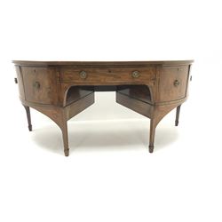 George III and later mahogany demi-lune sideboard, the figured top with rosewood band and box wood and ebony stringing, central tapering triangular drawer with rosewood band to drawer front, two cupboards to each side of central drawer, the far cupboard with catch stays disguised as an escutcheon, the front uprights inlaid with shell motifs and trailing husks, brackets inlaid with scrolled leafage, square tapering supports with spade feet, 
