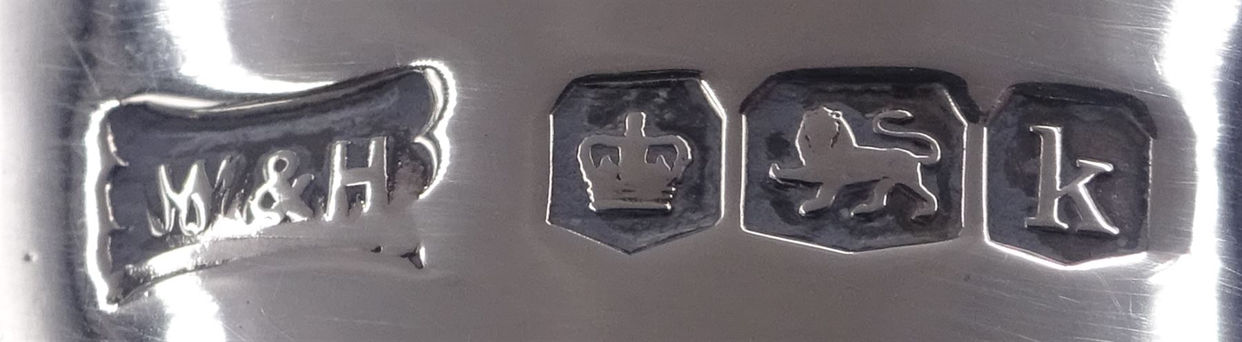 1920s silver trophy cup, with twin scroll handles and girdle, upon circular stepped foot,  the body with presentation engraving 'The Helen Andrews Memorial Cup, Handicraft Section', hallmarked Walker & Hall 1927, fixed upon ebonised wooden base with applied winners plaques, including base H18cm