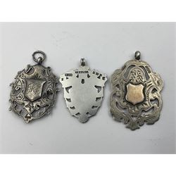 Seven Edwardian and later silver cartouche fobs, to include five gold faced examples and three double sided examples, all hallmarked with various dates and makers
