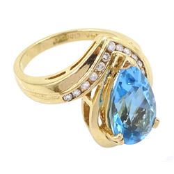 14ct gold pear cut blue topaz and round brilliant cut diamond ring, stamped