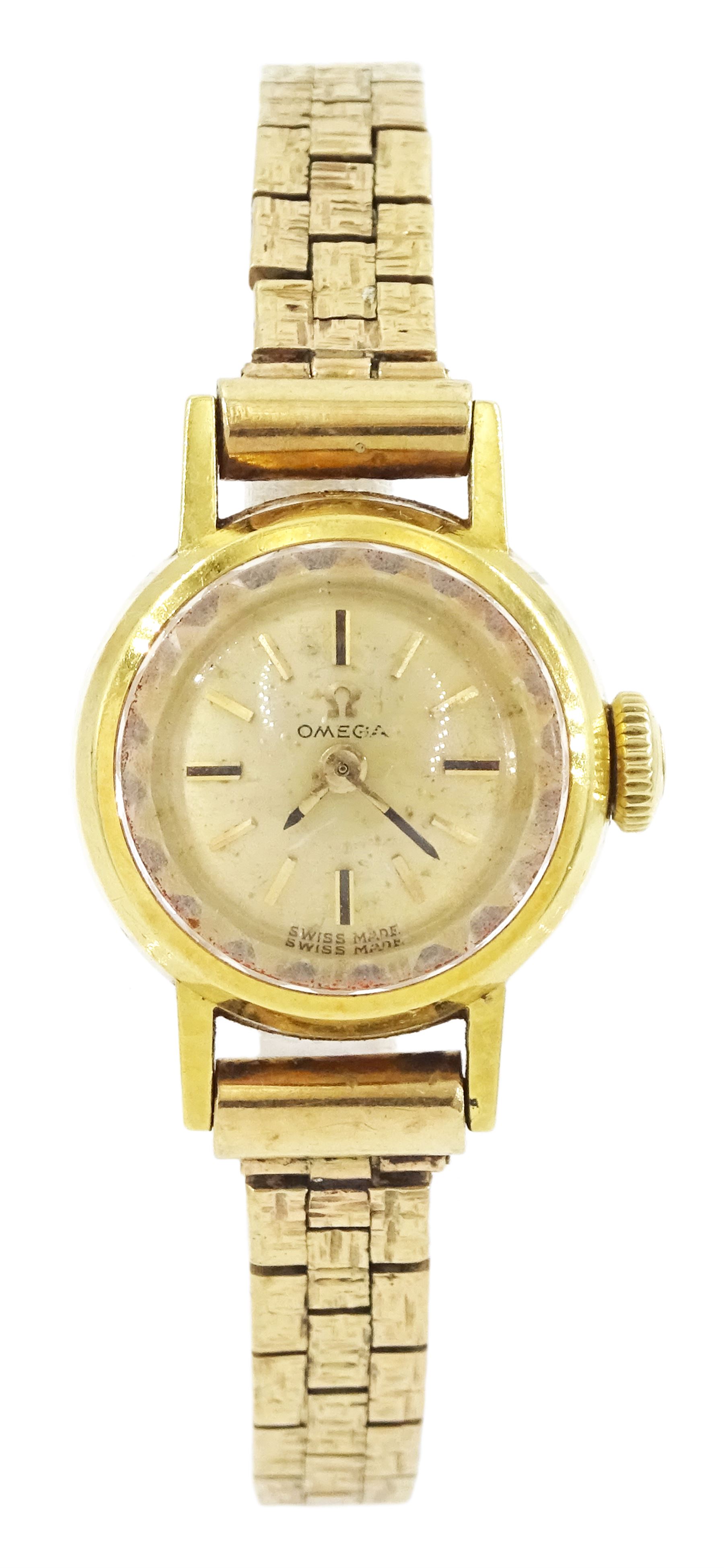Omega 18ct gold ladies manual wind wristwatch, champagne dial with baton hour markers, Helvetia hallmark, on 9ct gold bracelet, hallmarked